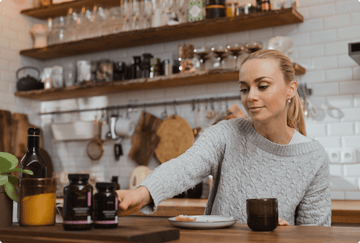 Woman taking nutrients during pregnancy 