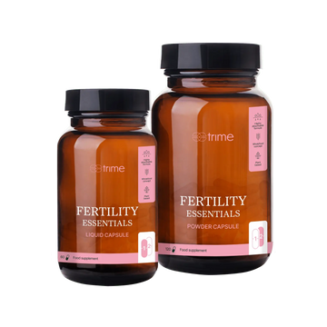 Two bottles of 'Fertility Essentials' supplements by Strime on a transparent background
