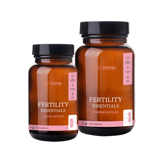 Two bottles of 'Fertility Essentials' supplements by Strime on a transparent background